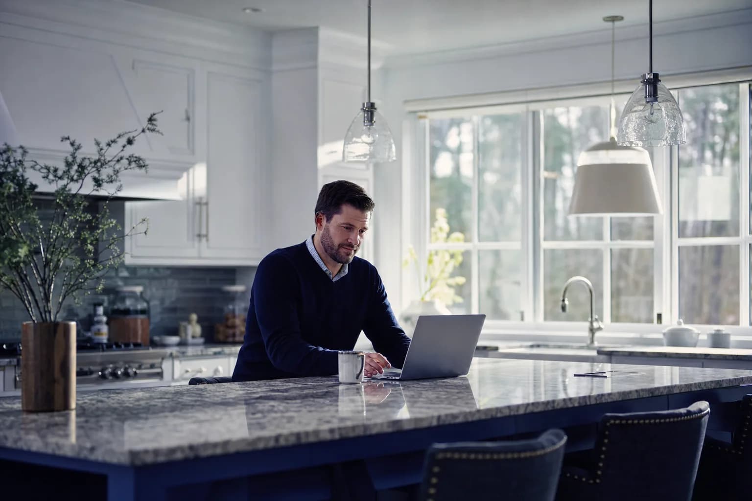 American kitchen with a polished granite island countertop